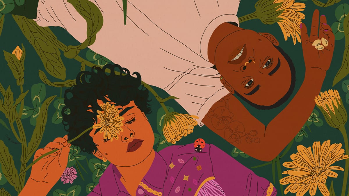 An image of two POC queer characters laying on ground, in a field of green clover and calendula. 